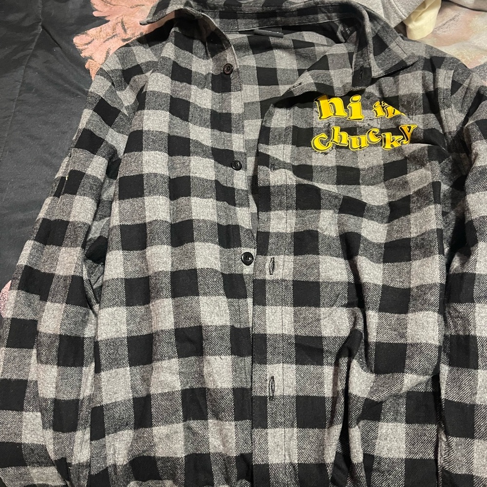 Black and Gray Checkered Shirt with Yellow Text